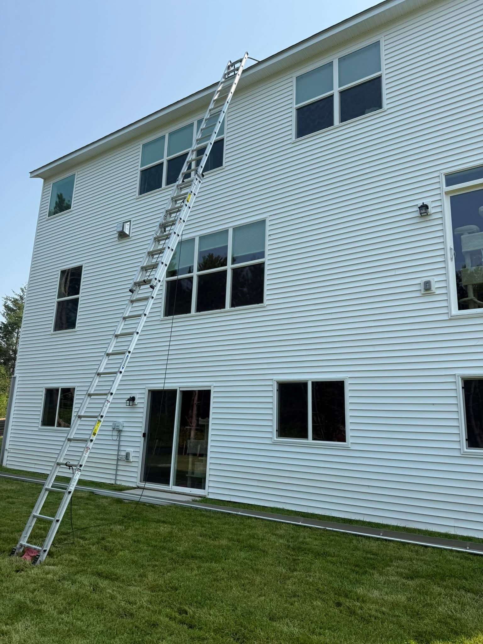 Seamless gutter installation on large residential home